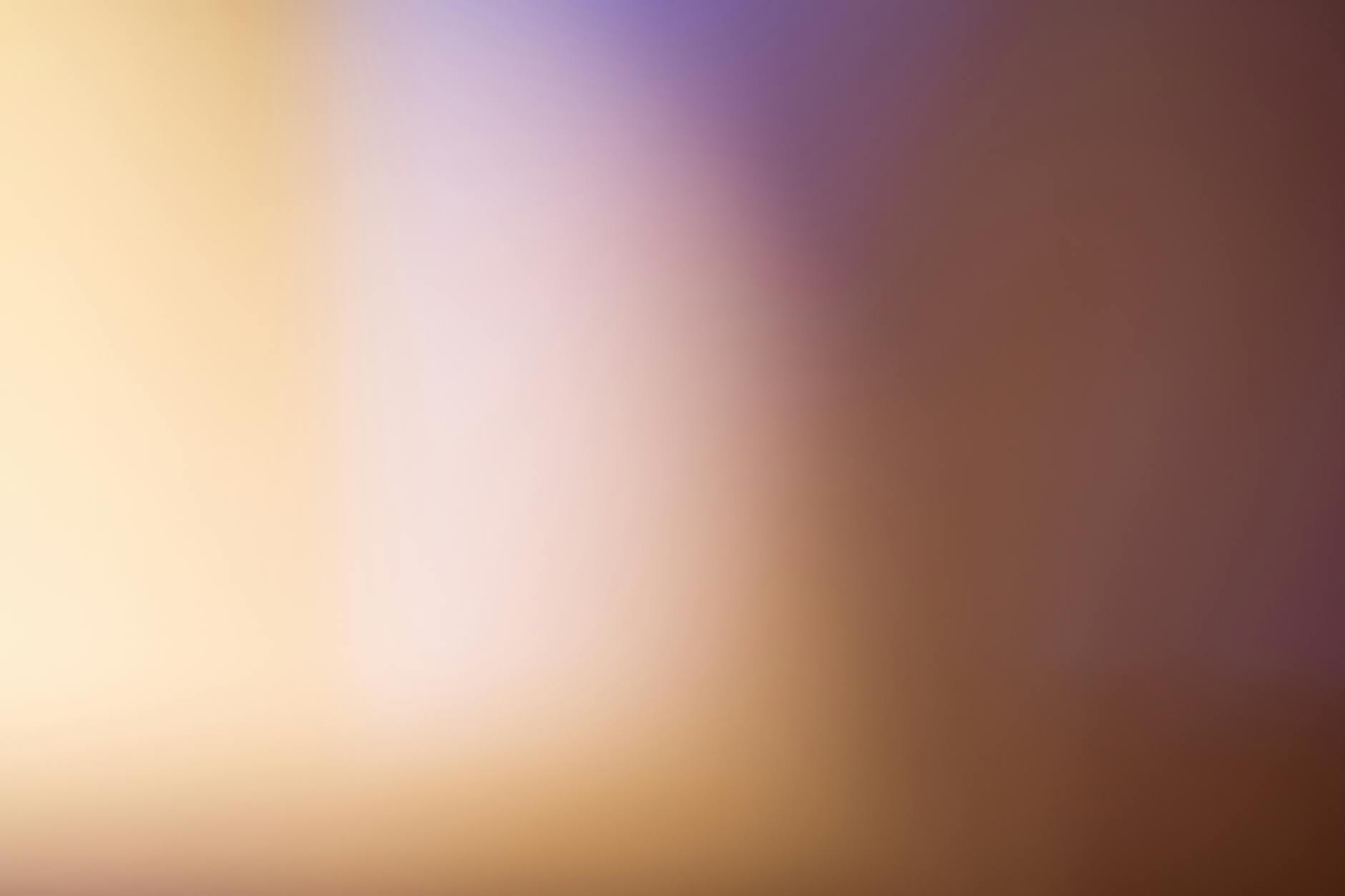 Abstract blurred background in warm dark tones, symbolizing sputtering issues with a steam cleaner